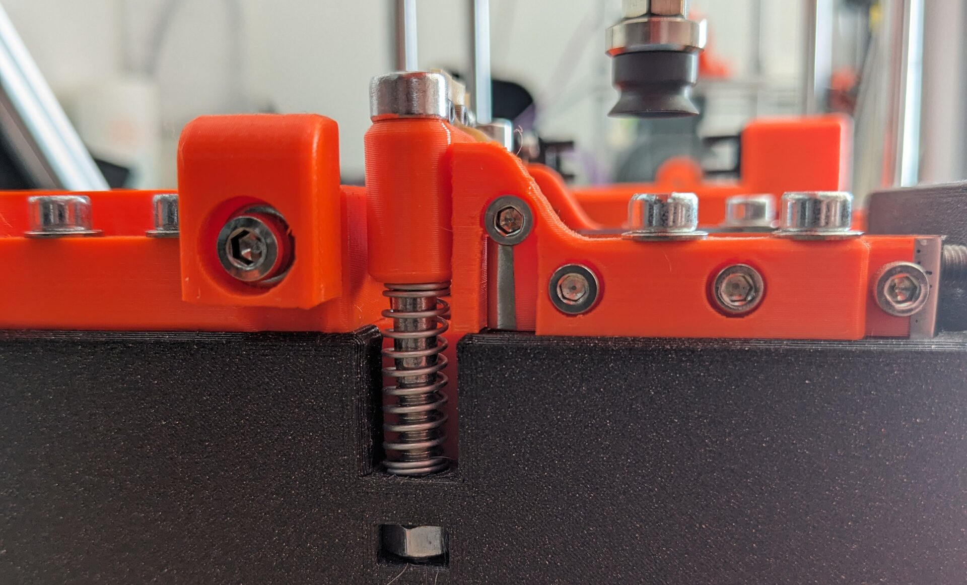 screw with spring for adjustment