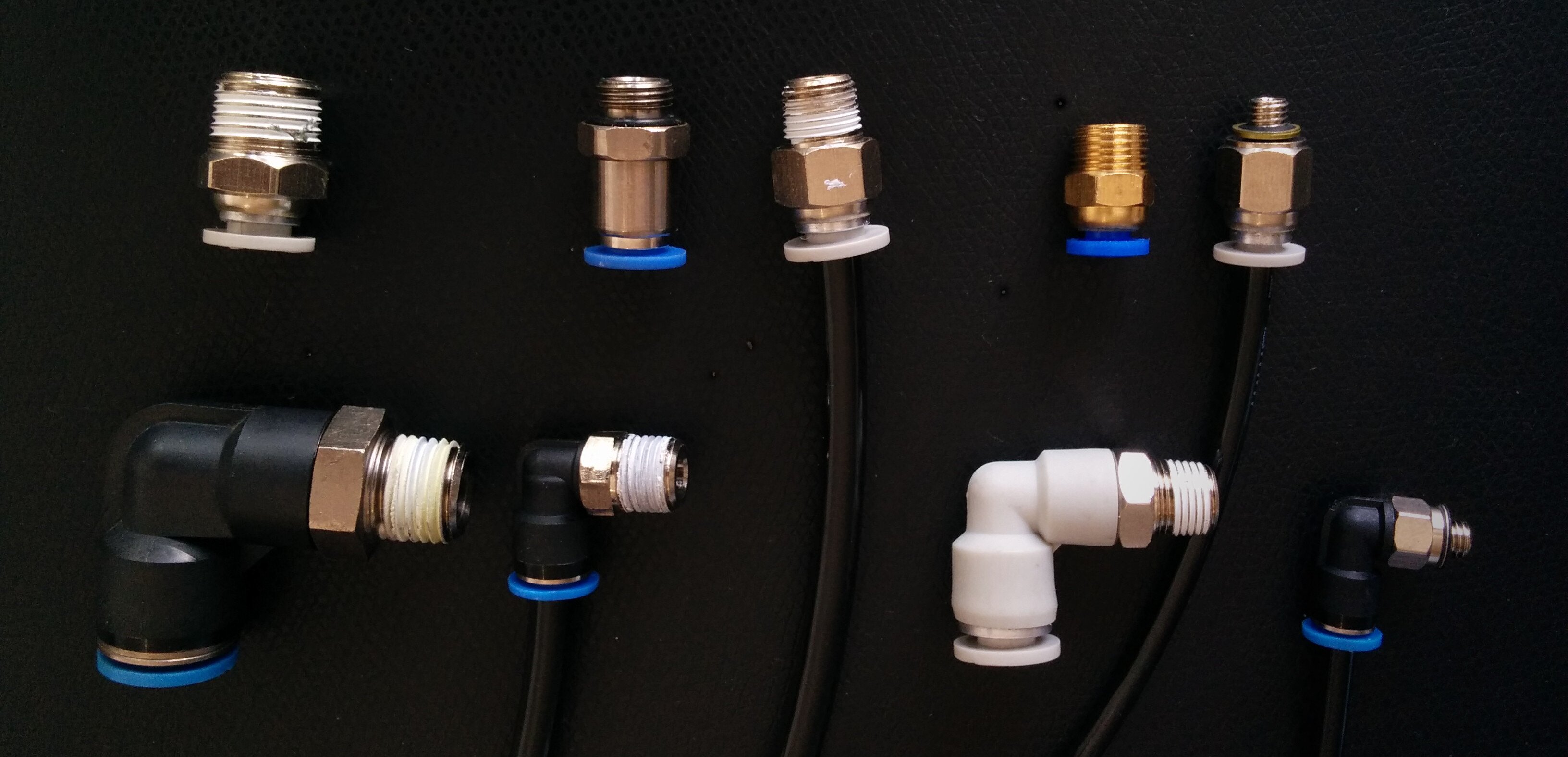 Image of straight and angled push-connect fittings